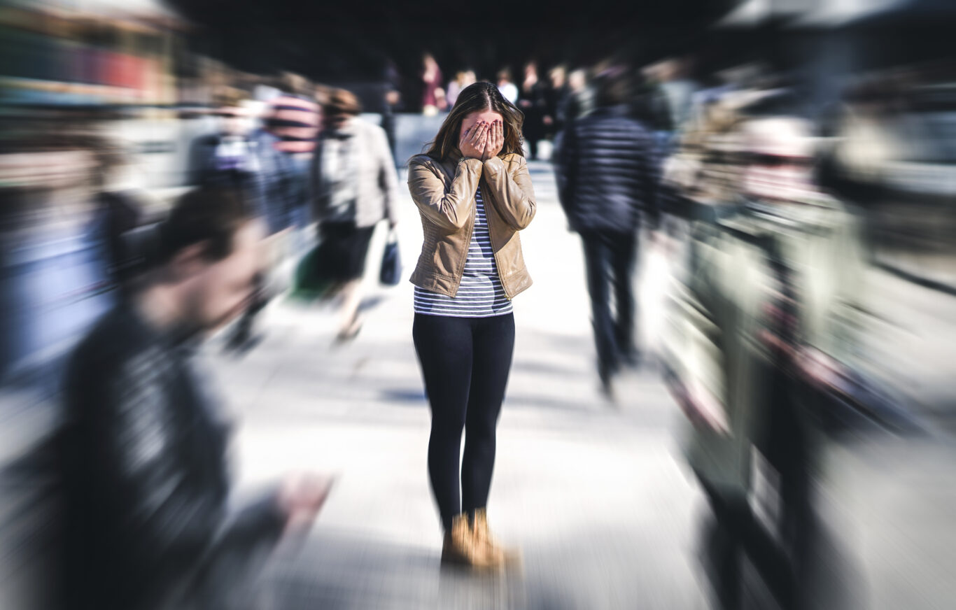 Panic attack in public place. Woman having panic disorder in cit